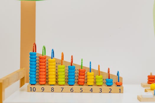 pexels-photo-8923967-8923967-1 Close-up of a colorful wooden counting toy with numbers and shapes, perfect for preschool learning.